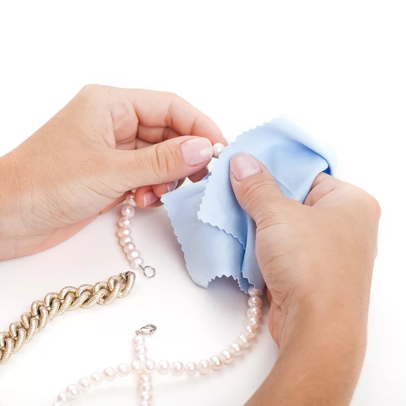 a woman cleaning jewellery